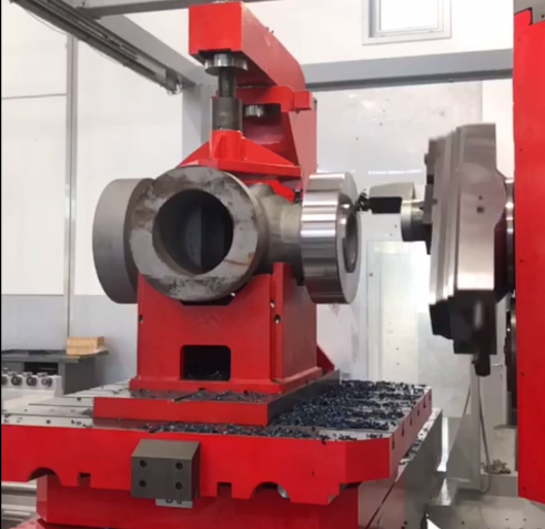 A DS600 RAM CNC system machining an industrial valve body for high-pressure pipelines